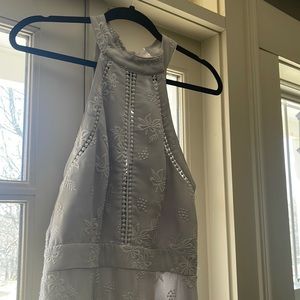 Light gray long dress with gray embroidery and embellishments.